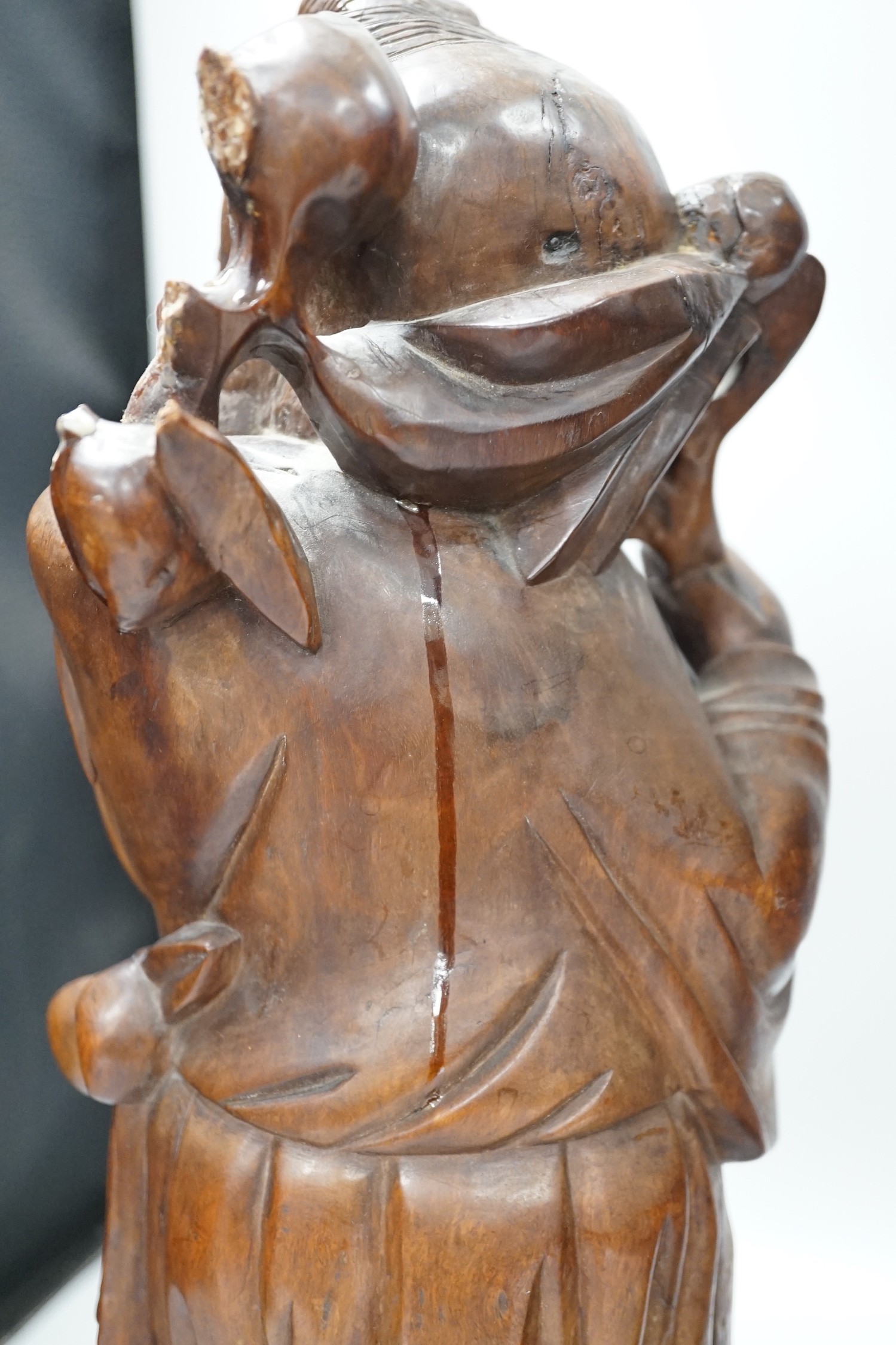 Two Chinese hardwood figures of luohans, early 20th century Tallest 48cm